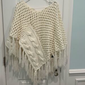 Elegant Cream Knit Poncho with Fringe